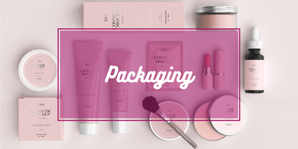 Packagings colore rosa di prodotti cosmetici di diverse forme e misure 